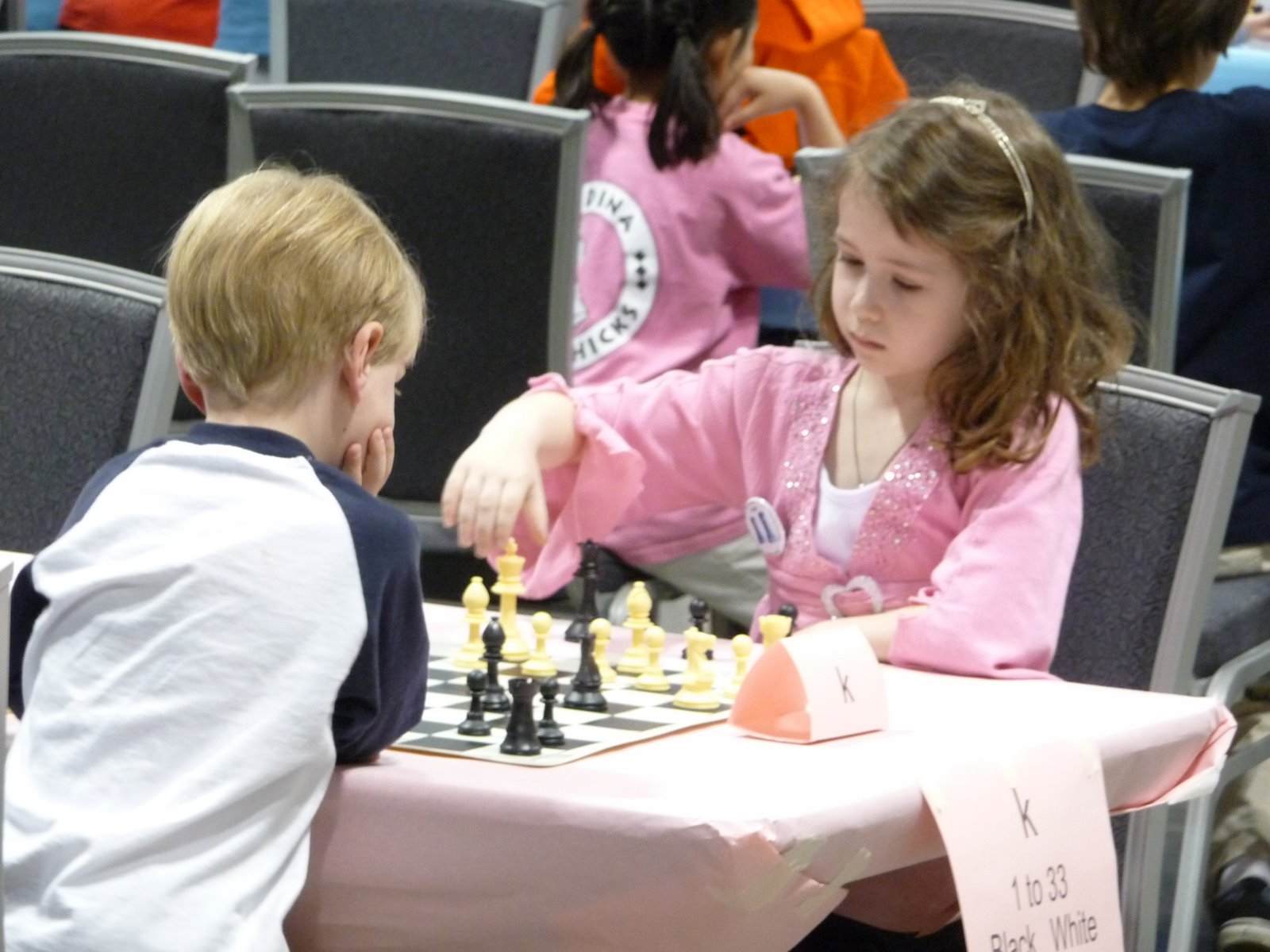 Young Naomi playing chess